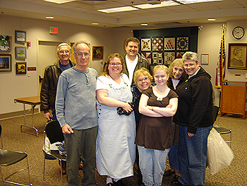 Annual Visual Arts Exhibit, Member artists hanging artwork for exhibit - group pose