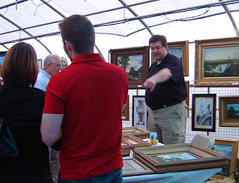Ives Farm - John O'Keefe working his booth and talking with art patrons